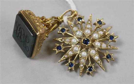 An Edwardian 9ct gold and bloodstone fob seal and a 9ct gold seed pearl and sapphire brooch.